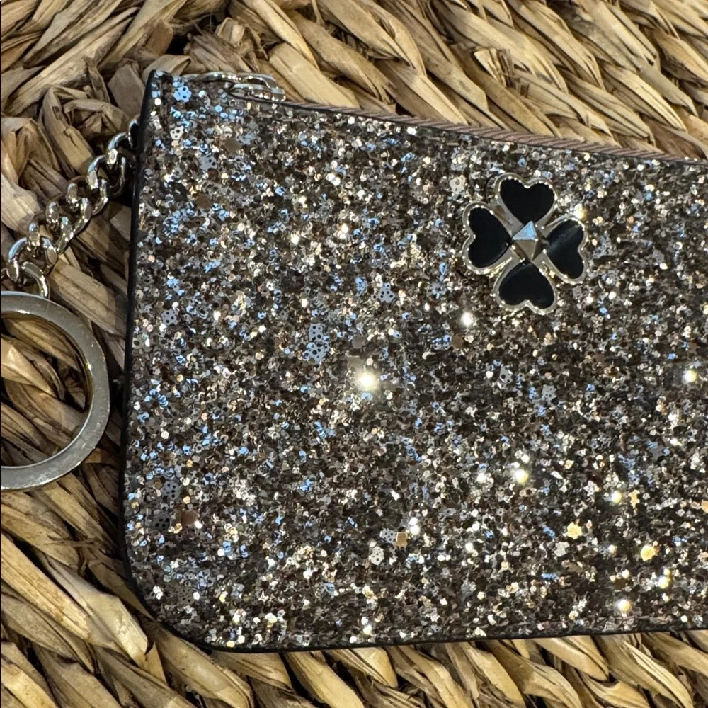 Kate Spade glitter clutch wristlet in gold and black